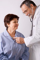 doctor examines woman