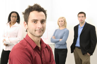 Man in foreground with others behind him.