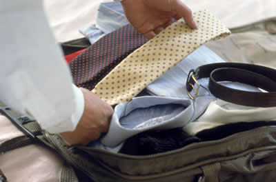 Man packing suitcase