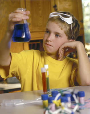 Boy doing science experiment