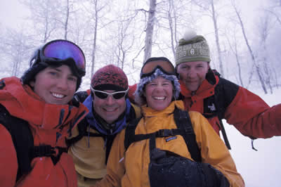 Skiers, riders enjoying snow